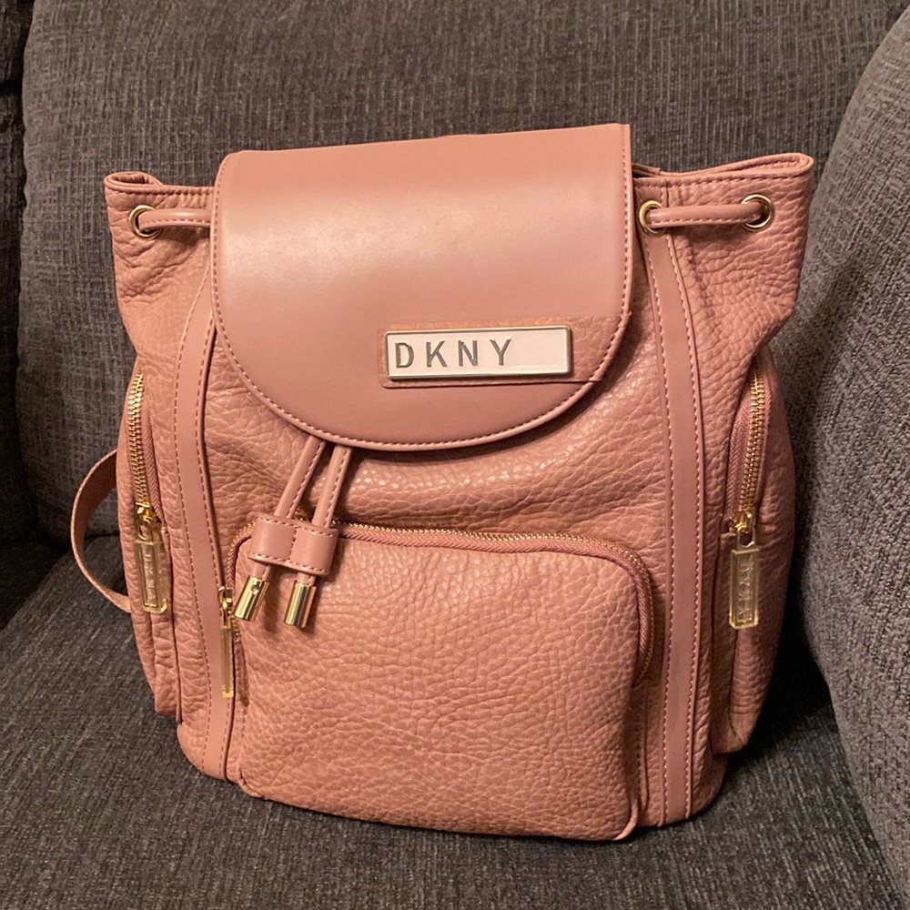 DKNY backpack with round pouch included. New, never used.